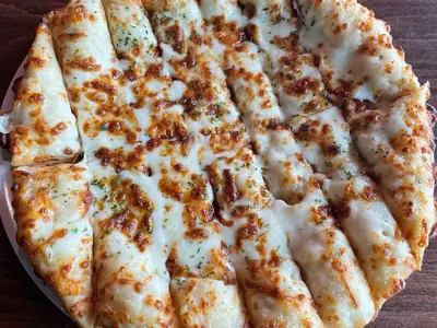 Cheesy bread sticks with melted, browned mozzarella at Durkin&rsquo;s Pizza